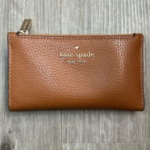 Kate Spade Leila small slim bifold wallet. Warm gingerbread color.